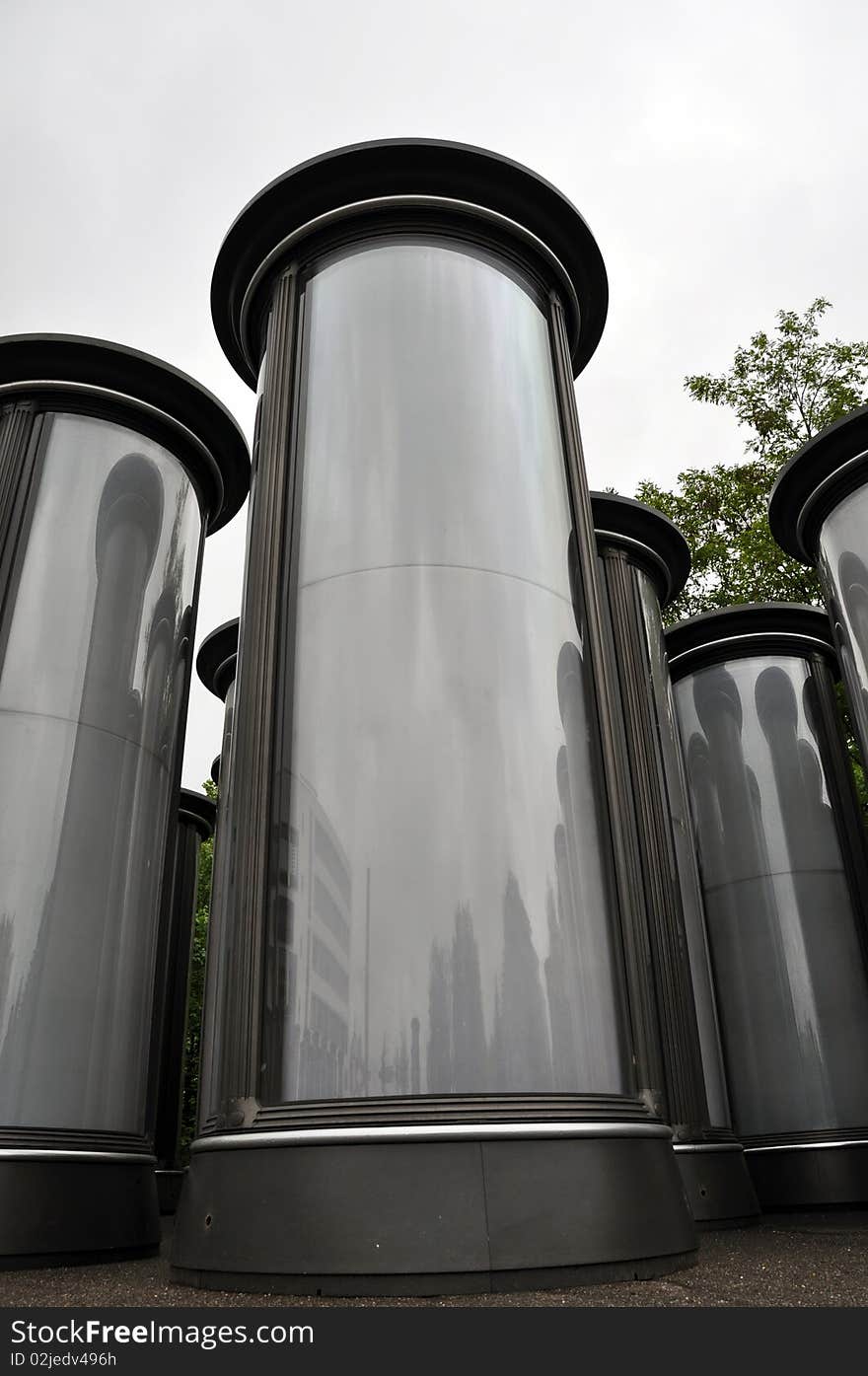 Rows of empty advertising columns stored in a backyard for later installation. Rows of empty advertising columns stored in a backyard for later installation