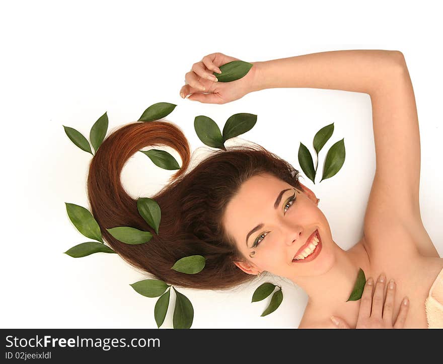 Beautiful young woman with green leaves. Beautiful young woman with green leaves