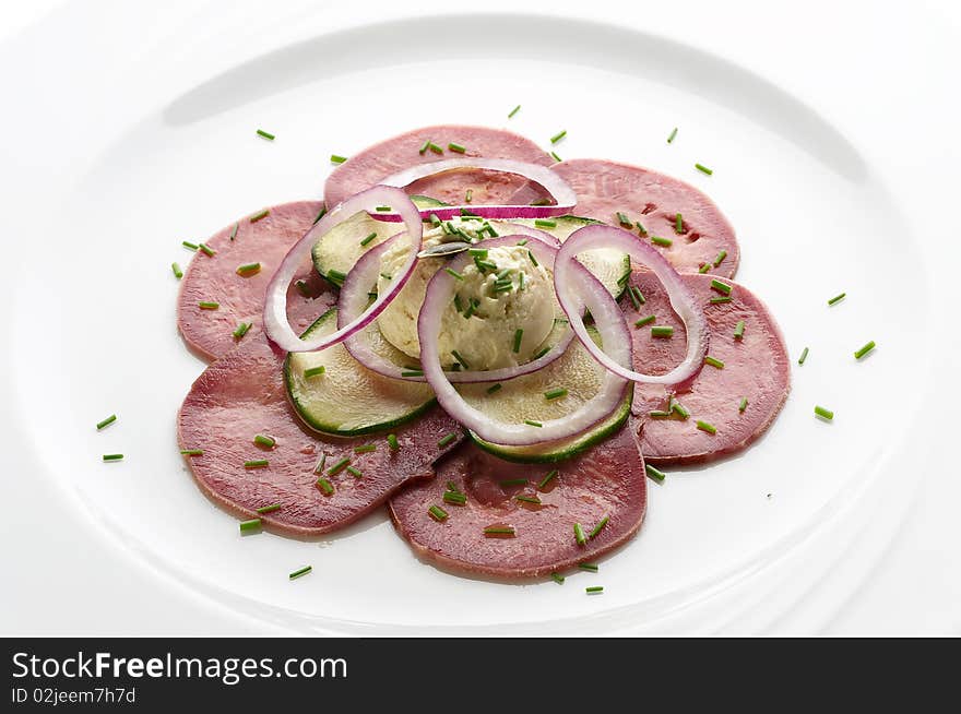 Slices of marinated beef tongue