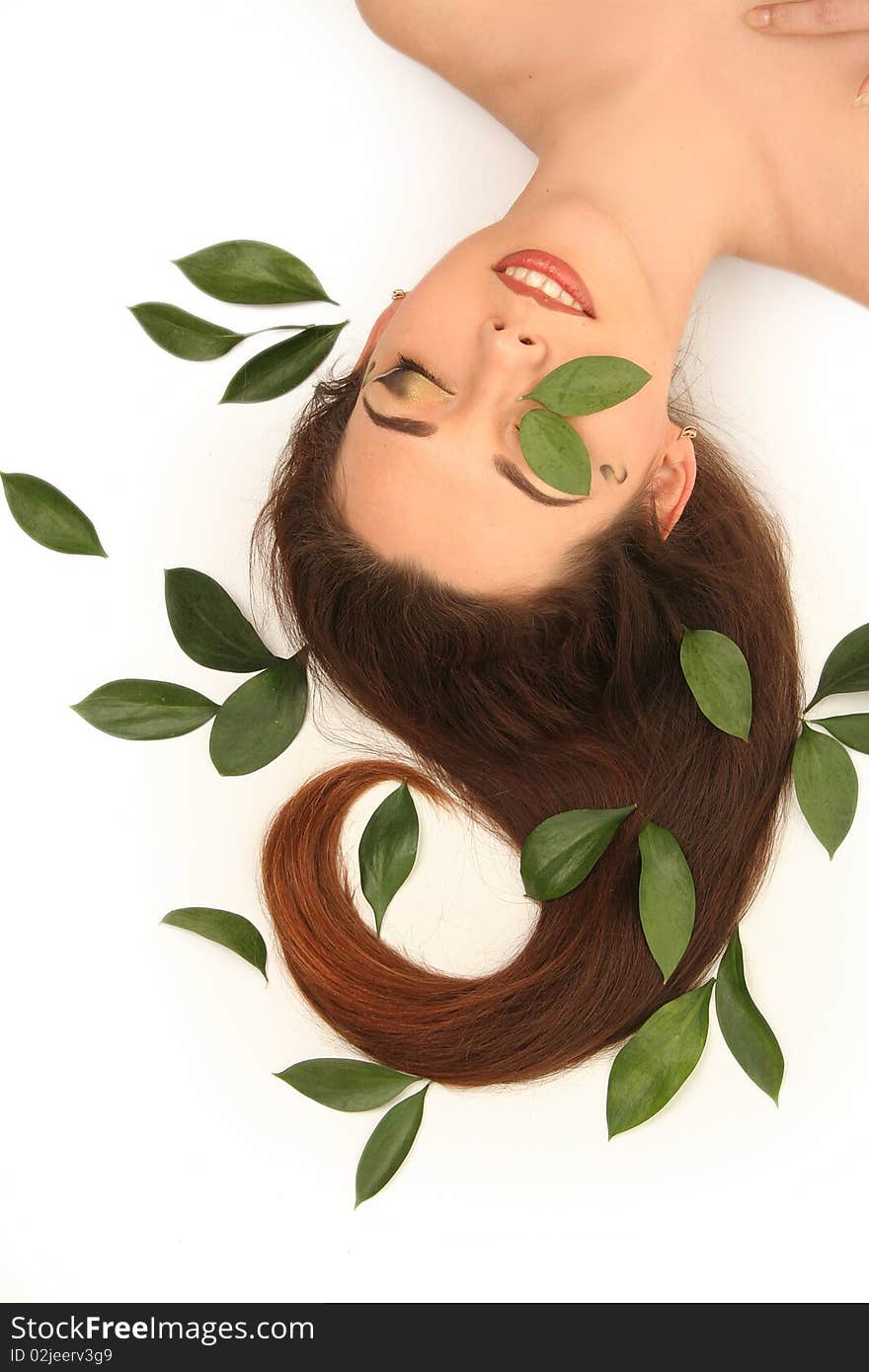 Beautiful young woman with green leaves. Beautiful young woman with green leaves