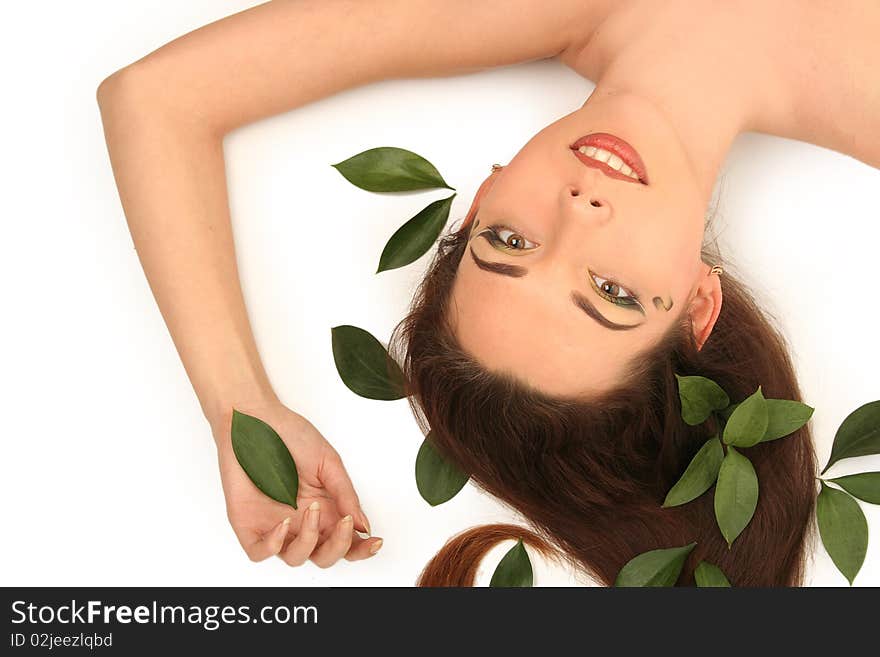 Beautiful young woman with green leaves. Beautiful young woman with green leaves