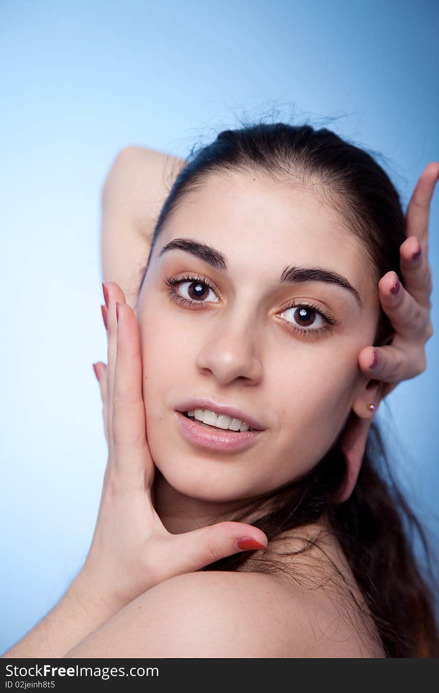 Portrait of young woman on blue background. Portrait of young woman on blue background