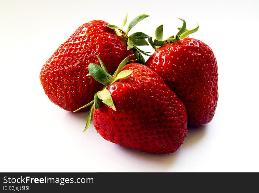 Ripe strawberries on a white background. Ripe strawberries on a white background