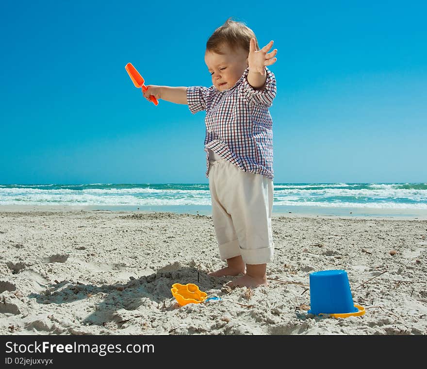 Child playing on a beach. Child playing on a beach