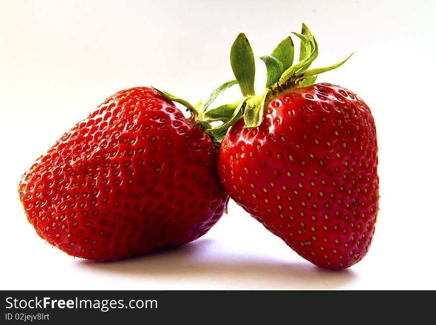 Ripe strawberries on a white background. Ripe strawberries on a white background