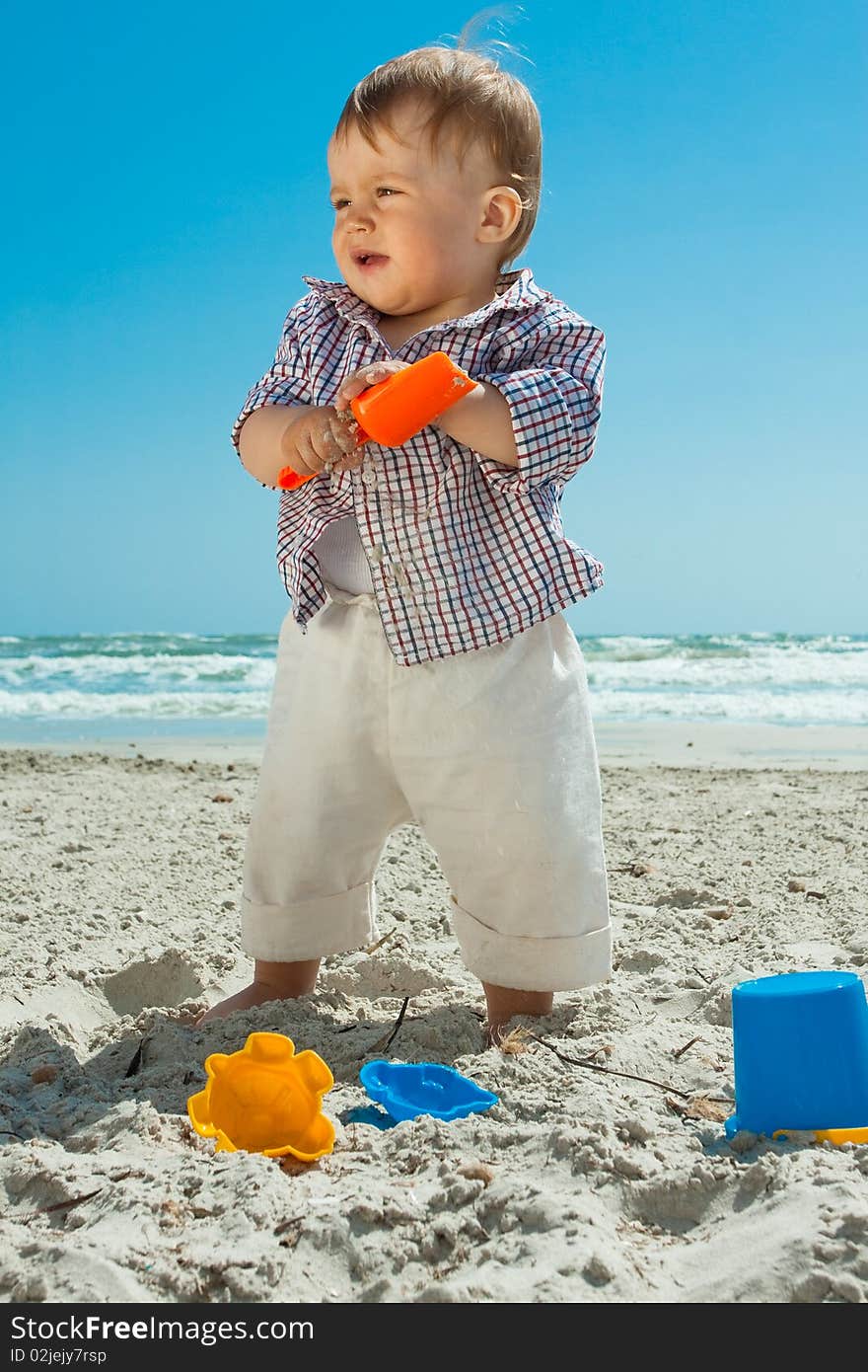 Child playing on a beach. Child playing on a beach