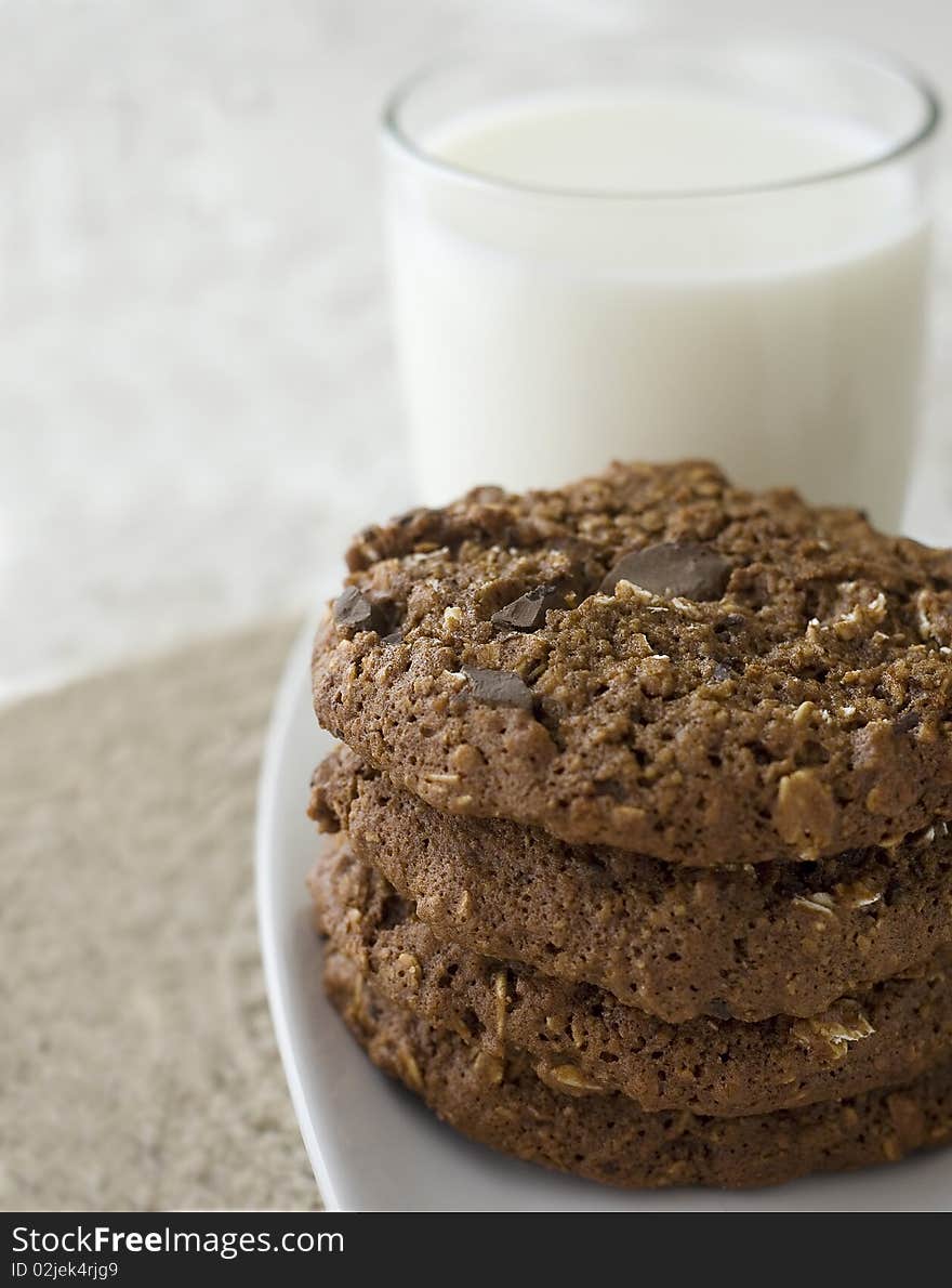 Oatmeal chocolate chip cookies with a glass of milk. Oatmeal chocolate chip cookies with a glass of milk.