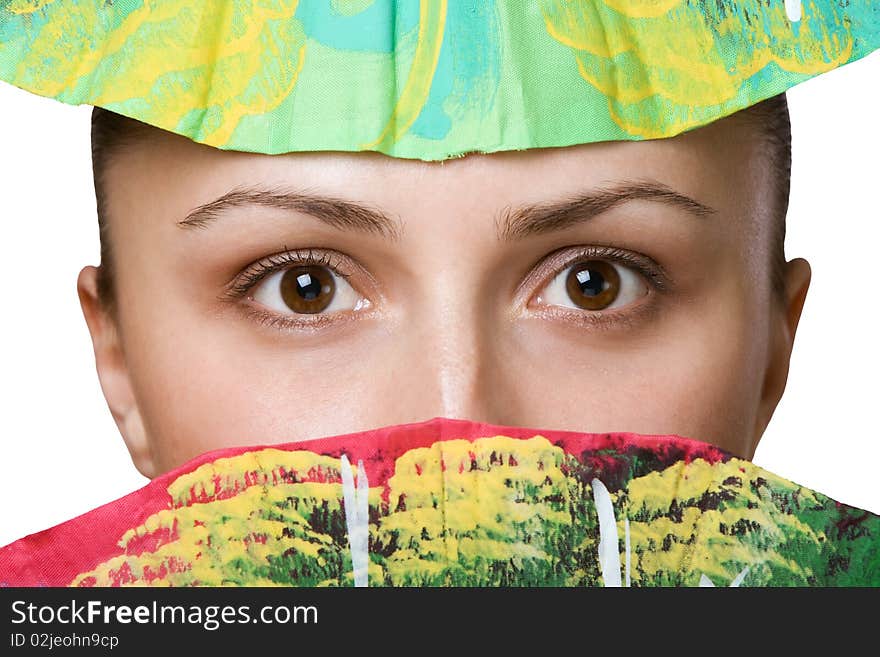 Eyes of beautiful woman covered by folding fans. Eyes of beautiful woman covered by folding fans