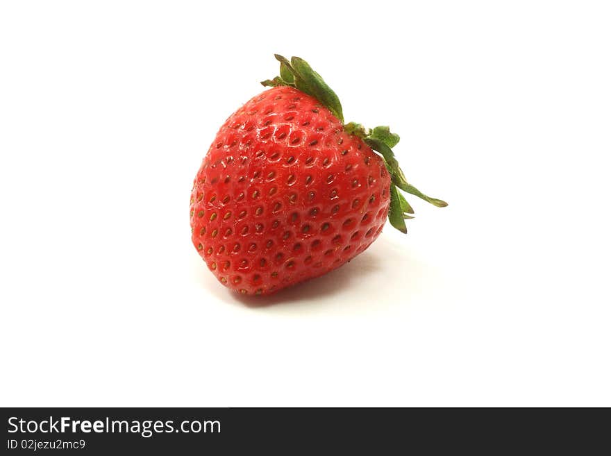 A single strawberry on a white background. A single strawberry on a white background.