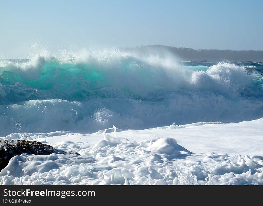 A wave in Big Sur leaping over a smaller wave. A wave in Big Sur leaping over a smaller wave.