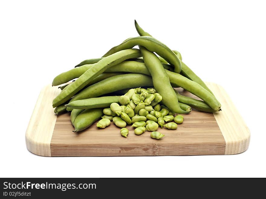 A platter with beans on white background. A platter with beans on white background