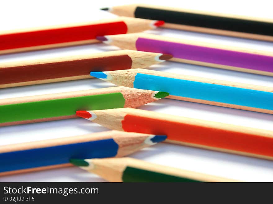 Colorful pencils on white background.