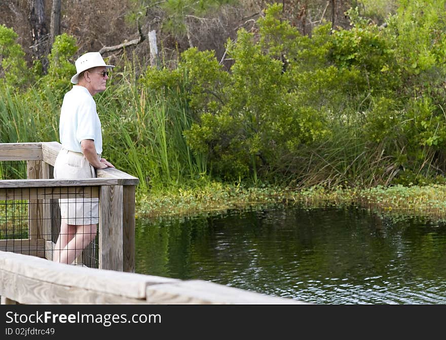 A senior man enoying nature. A senior man enoying nature.