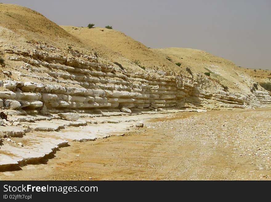 Stone layers in a desert river uncovered by the flood. Stone layers in a desert river uncovered by the flood.