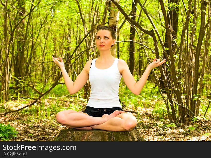 Young woman in meditation pose. Young woman in meditation pose