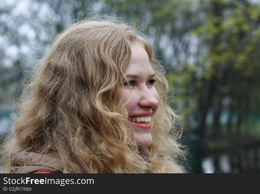 Face of the blondie girl outdoors