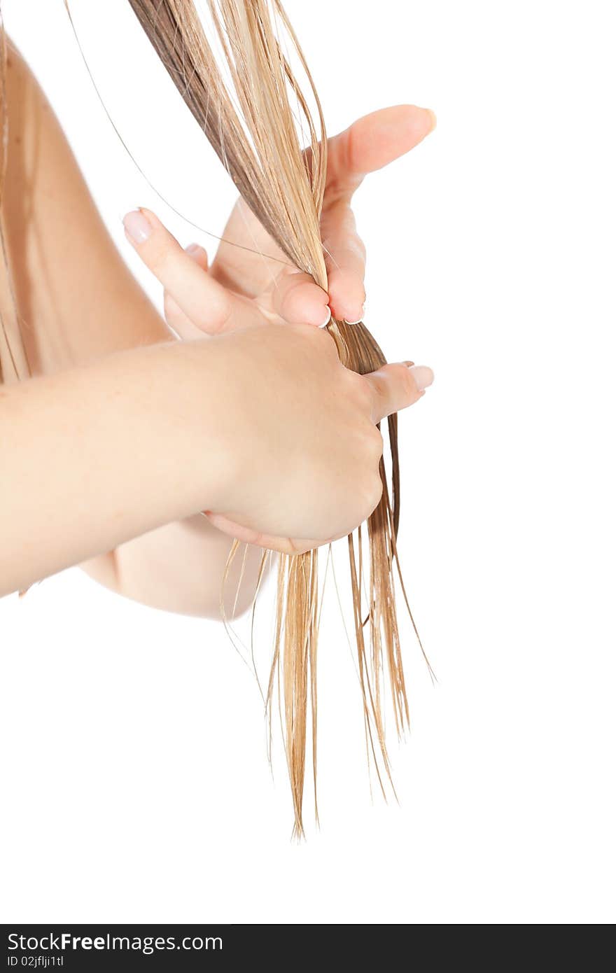 Woman cutting hair close-up on white isolated background