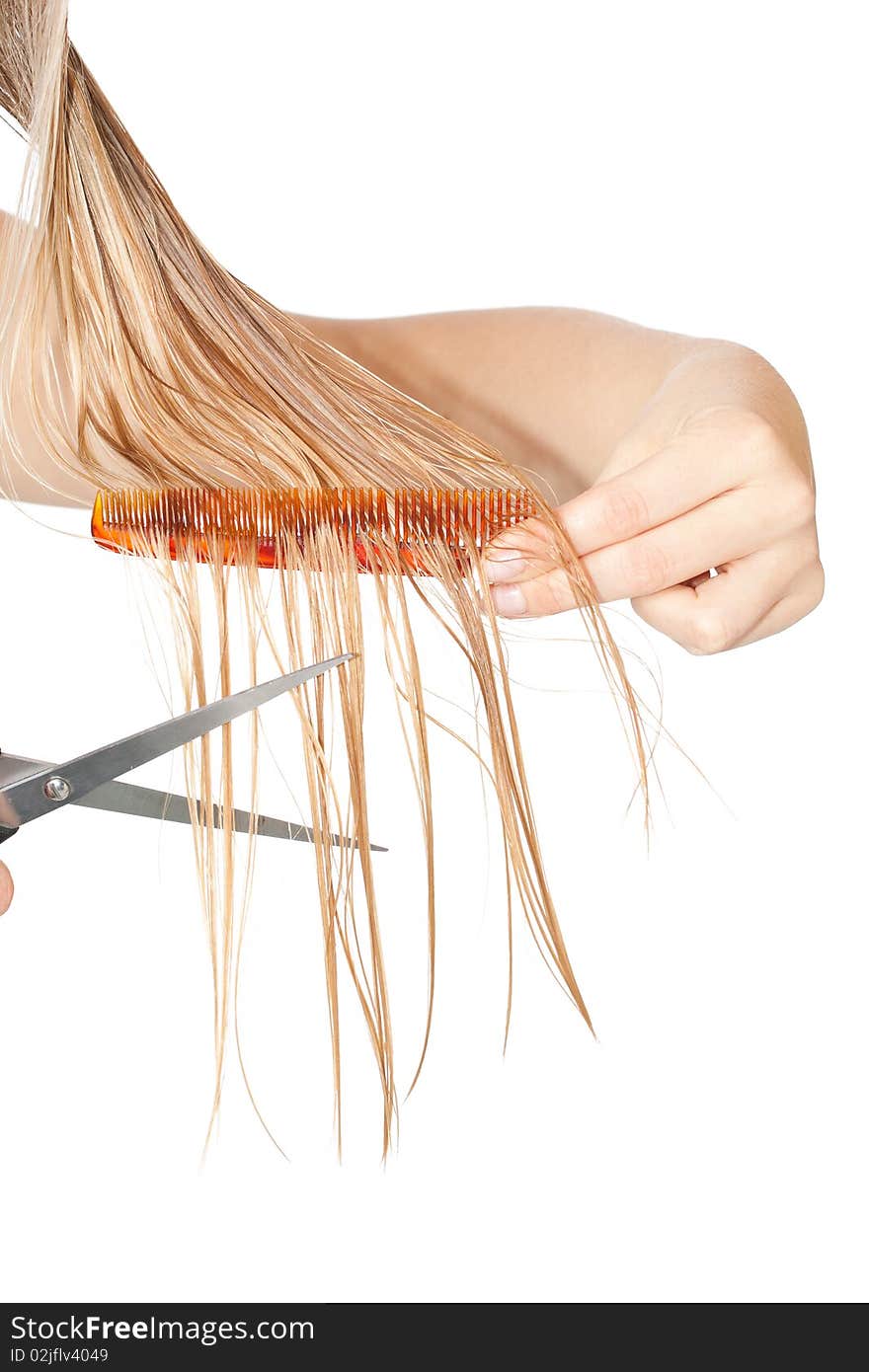 Woman cutting hair close-up on white isolated background