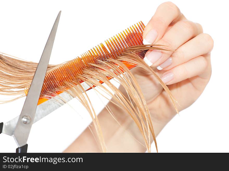 Woman cutting hair close-up on white isolated background