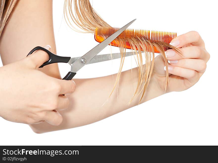 Woman cutting hair close-up on white isolated background