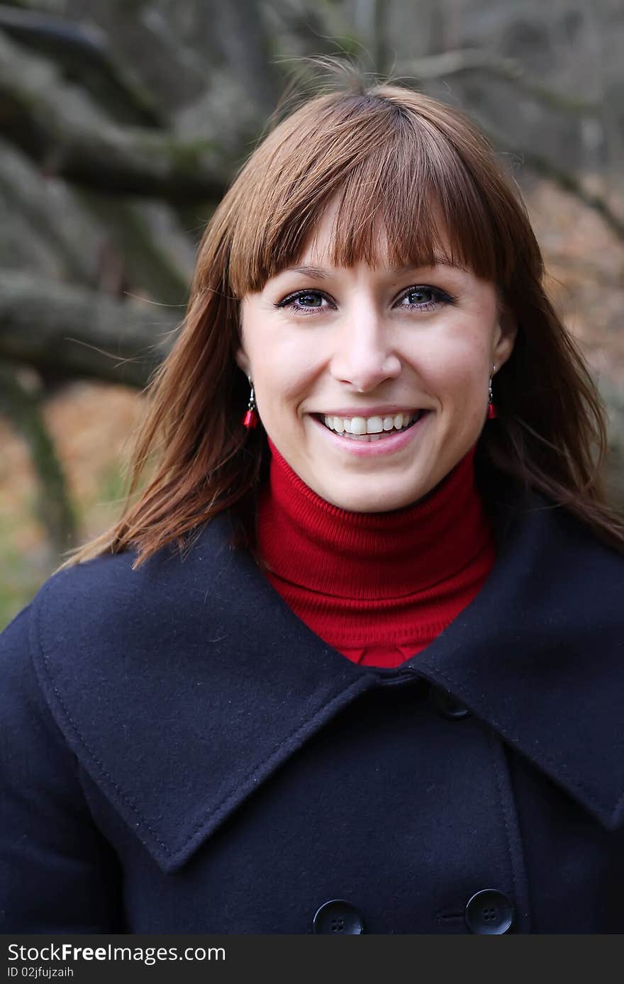 Young female smiling in autumn environment