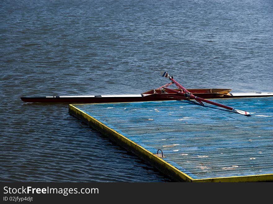 Empty kayak - wooden dock - water