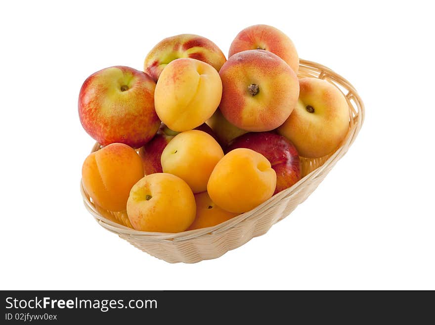 Fruits in basket with hand made clipping path, isolated against white background