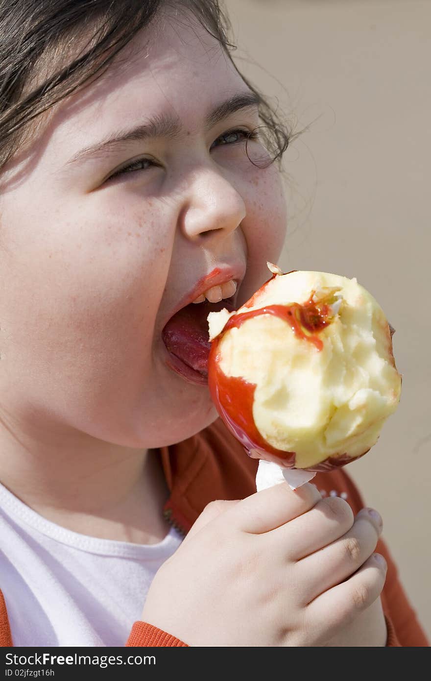 Little girl eating apple outdoor. Little girl eating apple outdoor