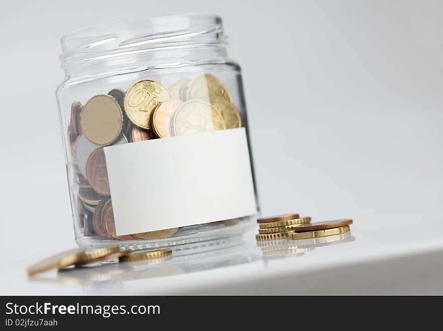 Jar of coins with label