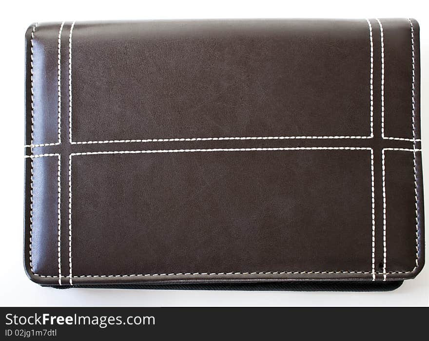 Brown leather folder with white stitching and isolated on a white background