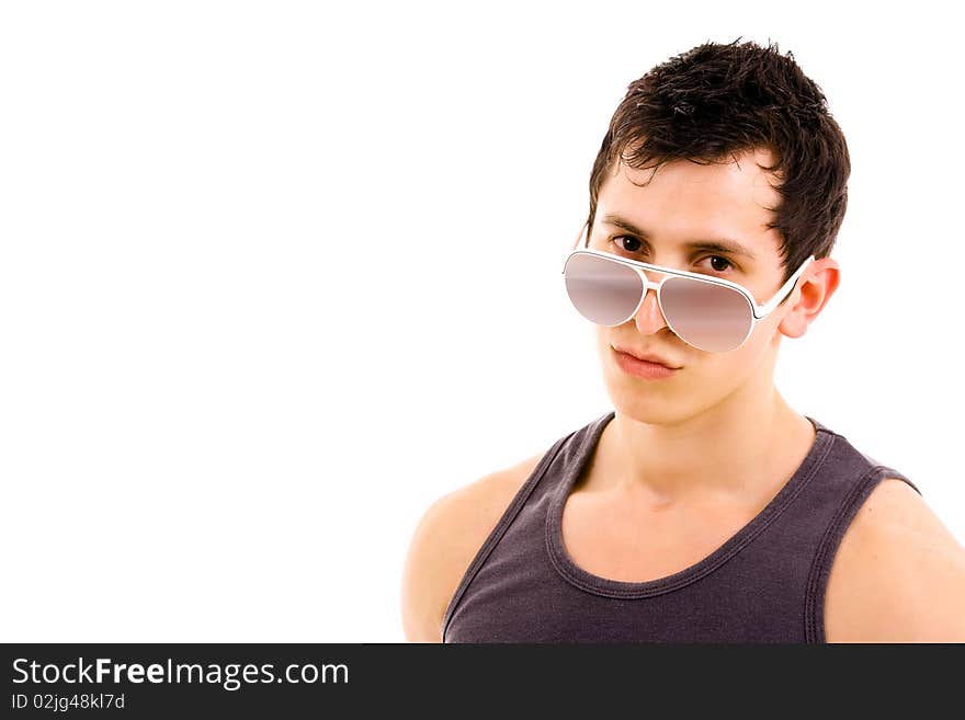 Portrait of stylished young man wearing sunglasses on white background