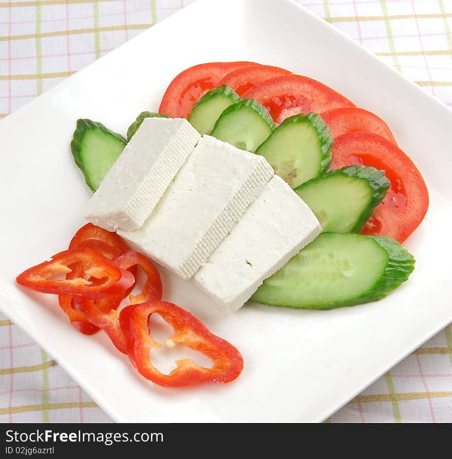 Nice looking and healthy dish of feta cheese and vegetables. Nice looking and healthy dish of feta cheese and vegetables