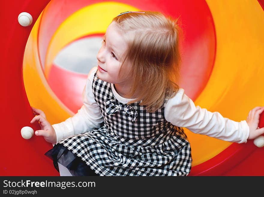 A 3 year old girl in playground equipment. A 3 year old girl in playground equipment