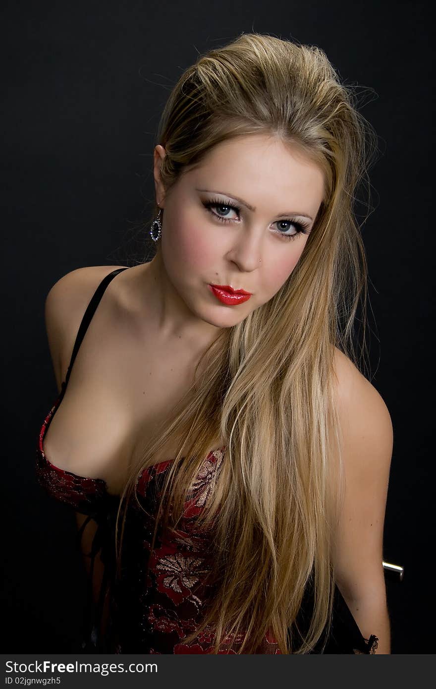 Portrait of young playful woman in corset. Portrait of young playful woman in corset.