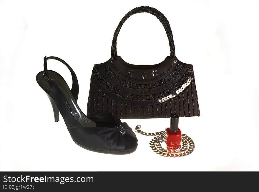 Black shoe, handbag and silver necklace