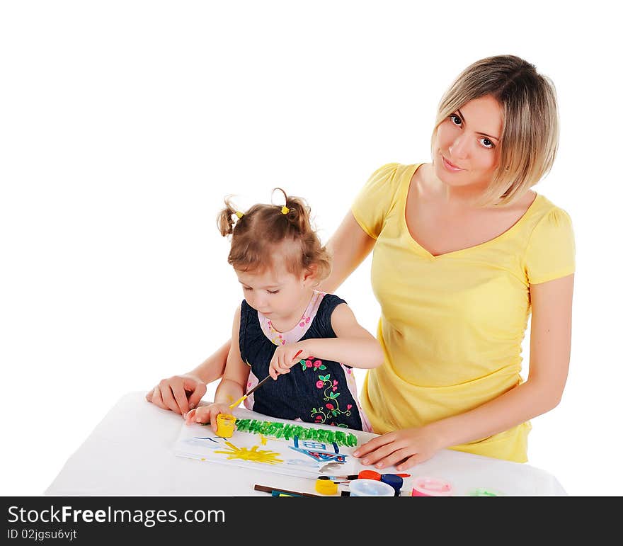 A young mom and her little daughter paint colors in this album