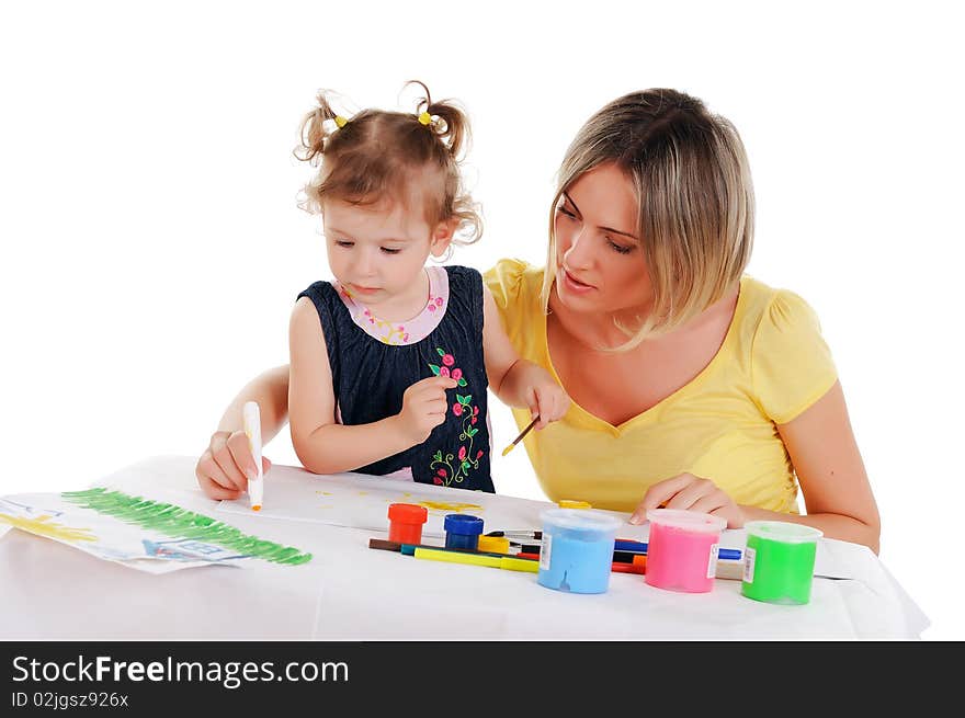 A young mom and her little daughter paint colors in this album