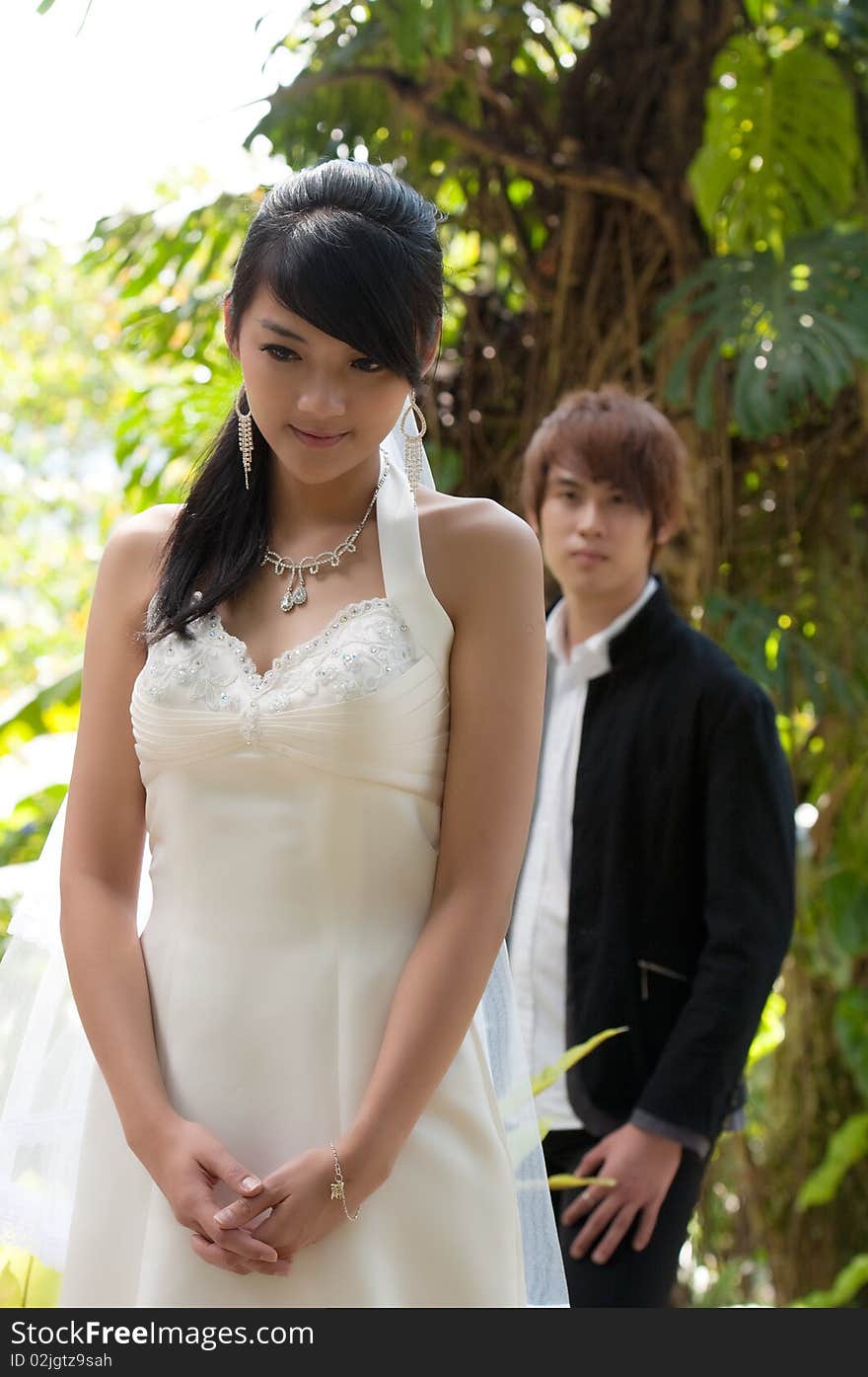 Beautiful happy young couple outdoor on a bright sunny day. Beautiful happy young couple outdoor on a bright sunny day.