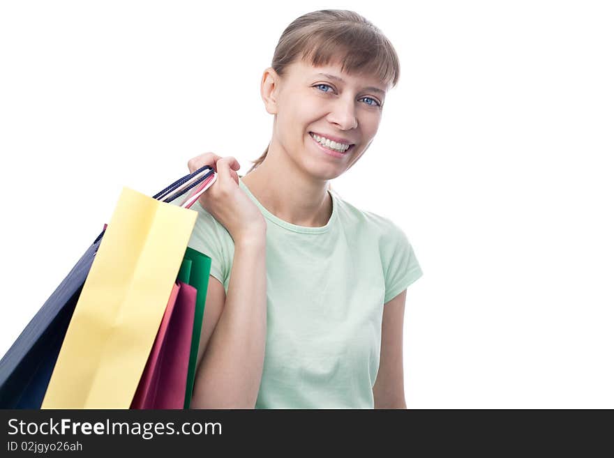 Happy woman with shopping bags over white background