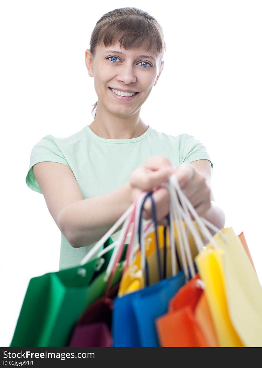 Happy woman with shopping bags over white background