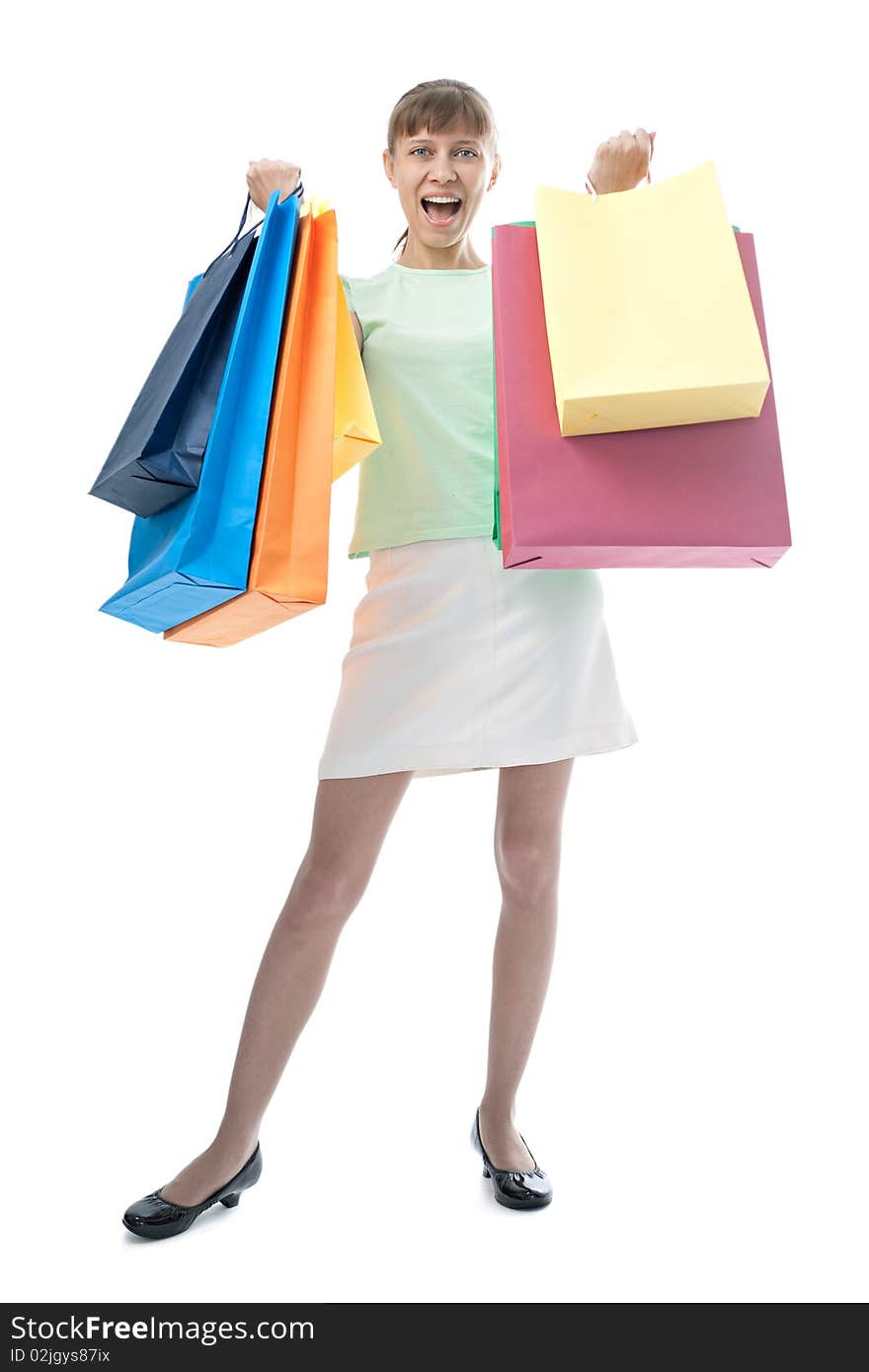 Happy woman with shopping bags over white background