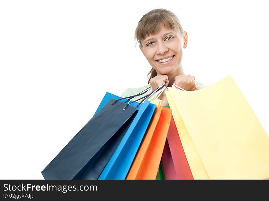 Happy woman with shopping bags over white background