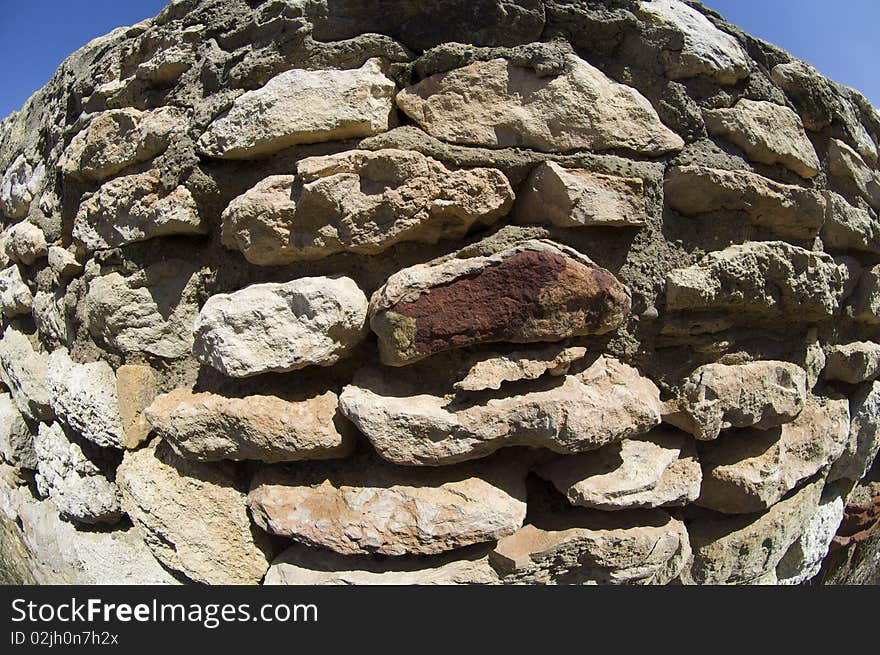 Stone wall deformed with the perspective of a fisheye