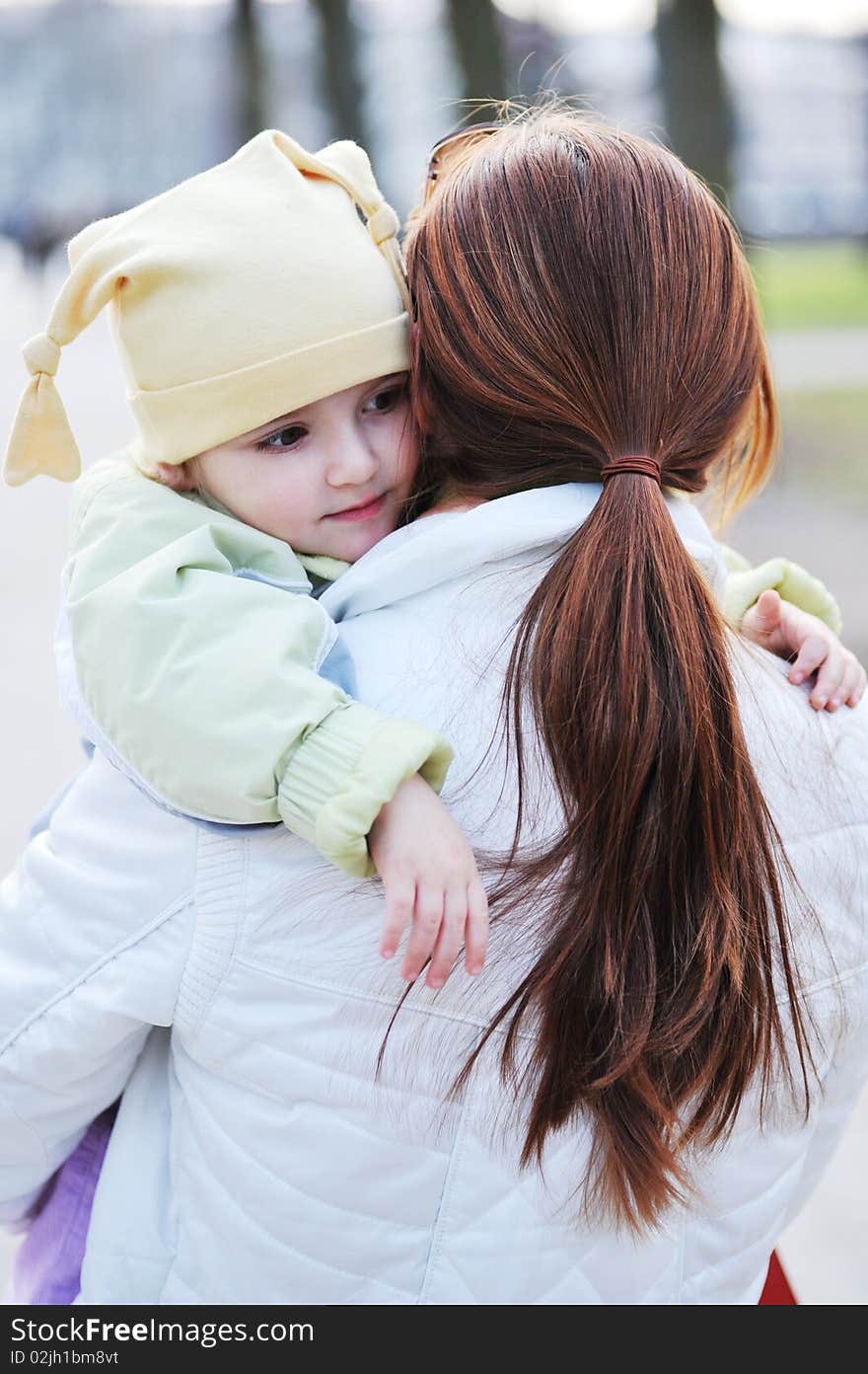 Mother holds little girl on hands. Mother holds little girl on hands