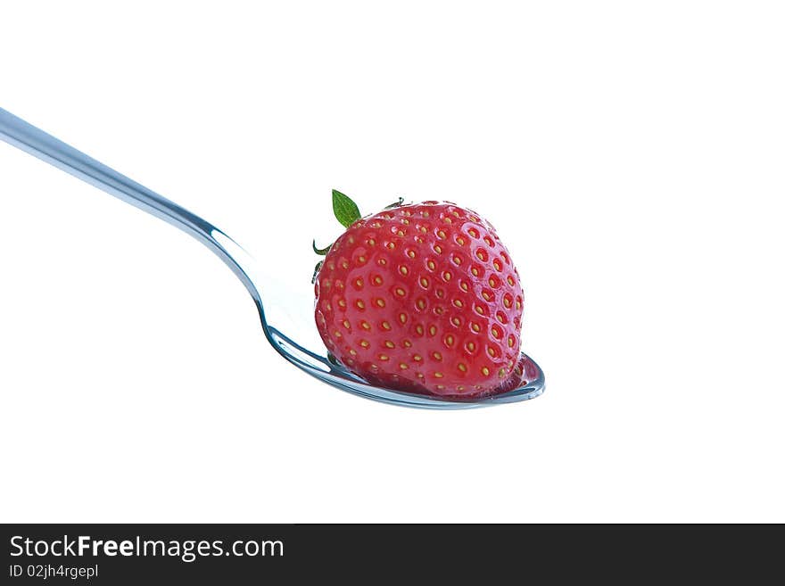 Single ripe fresh strawberry on spoon isolated on white. Clipping path included