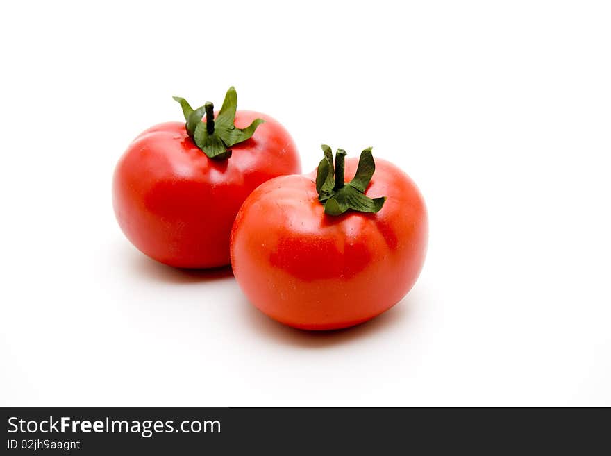 Refine tomatoes onto white background