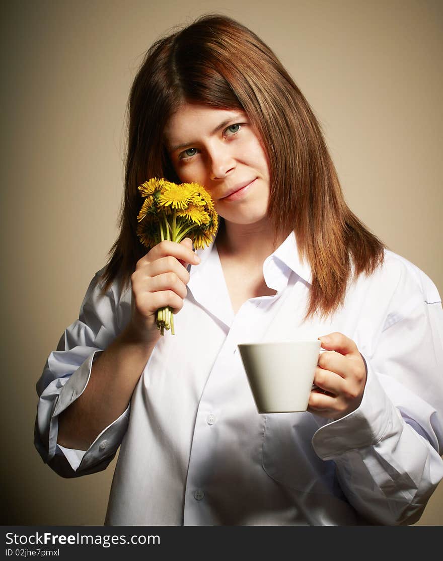 Girl with coffee. studio shot