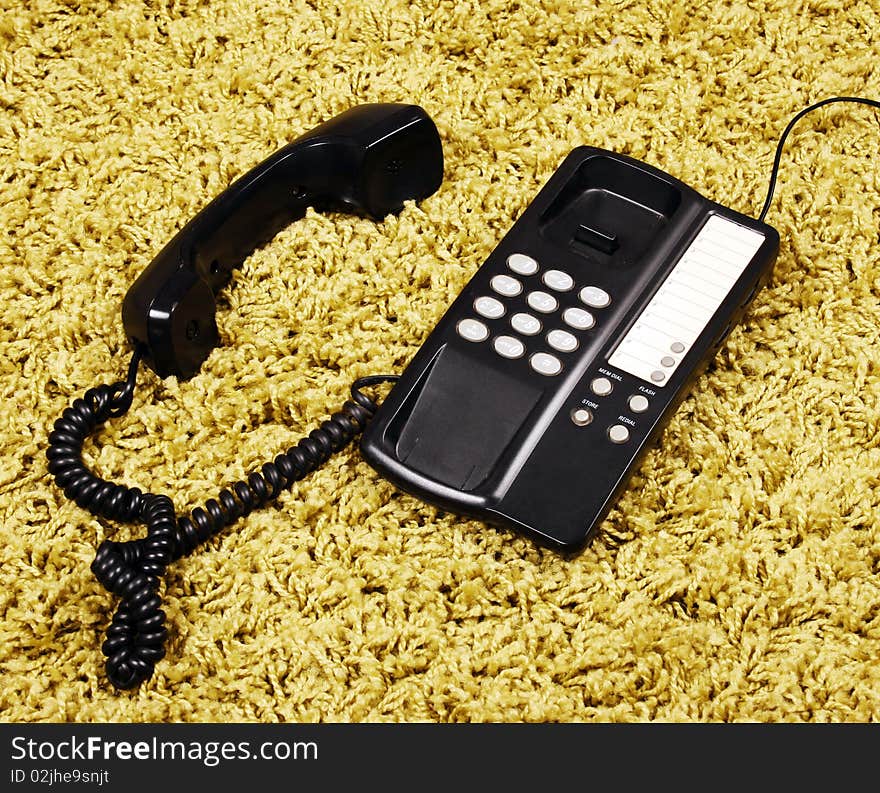 Vintage telephone on the carpet