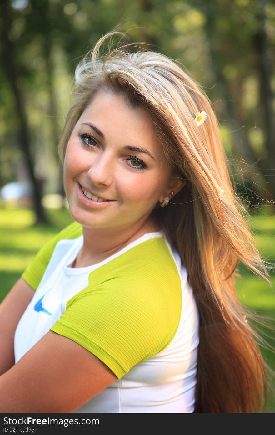 Beautiful young woman relaxing on a grass. Beautiful young woman relaxing on a grass