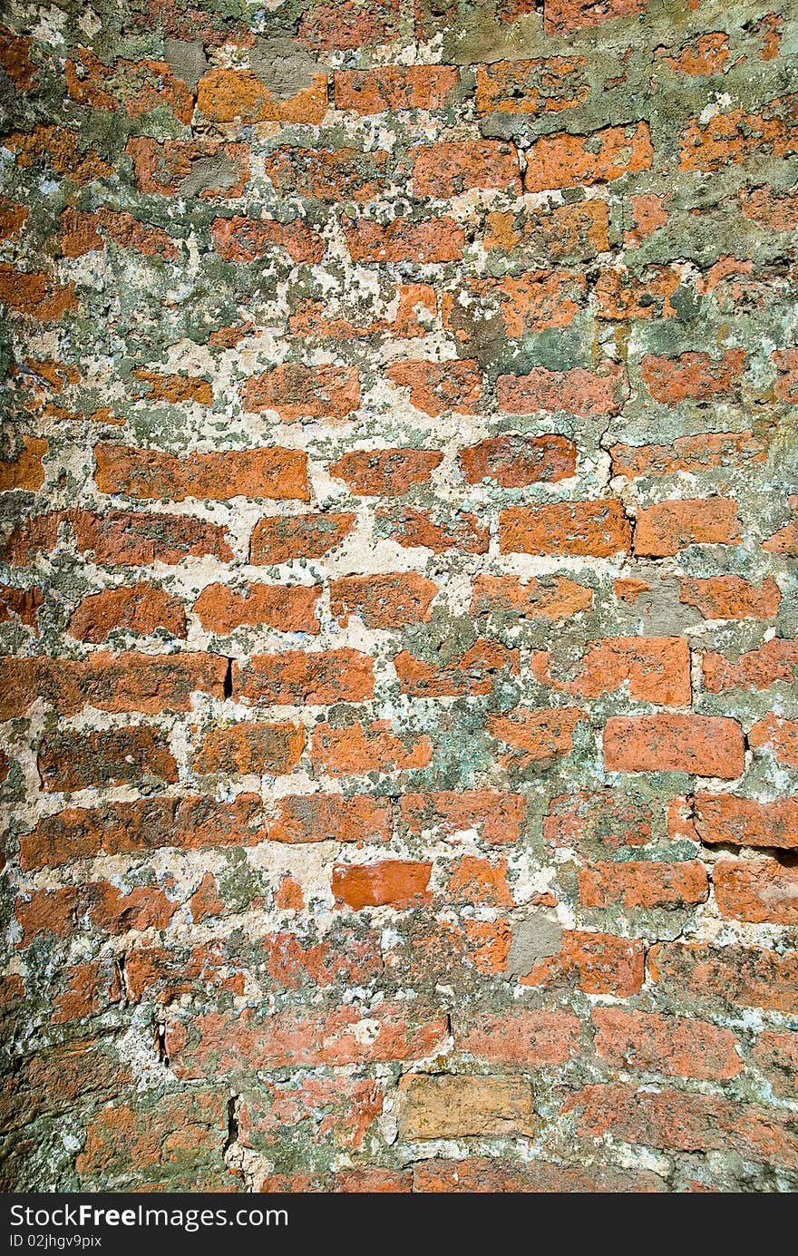 Vintage uneven red brick wall built semicircle. Vintage uneven red brick wall built semicircle